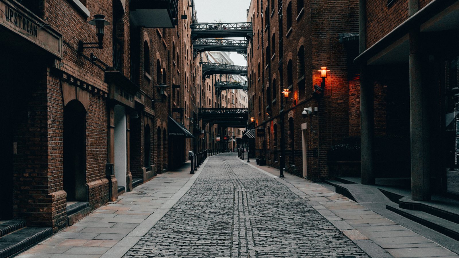 A cobbled London alley between old brick buildings, a place Paulius used to walk